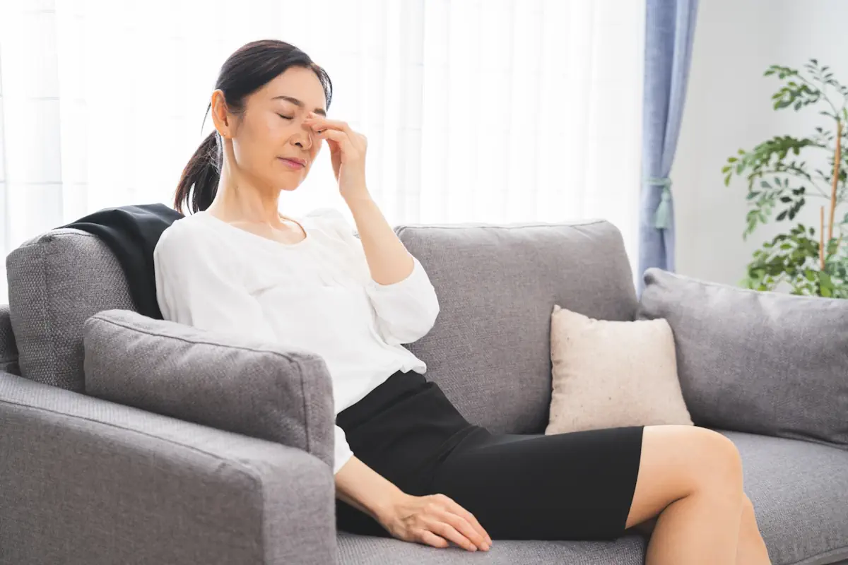 つらそうな中年女性